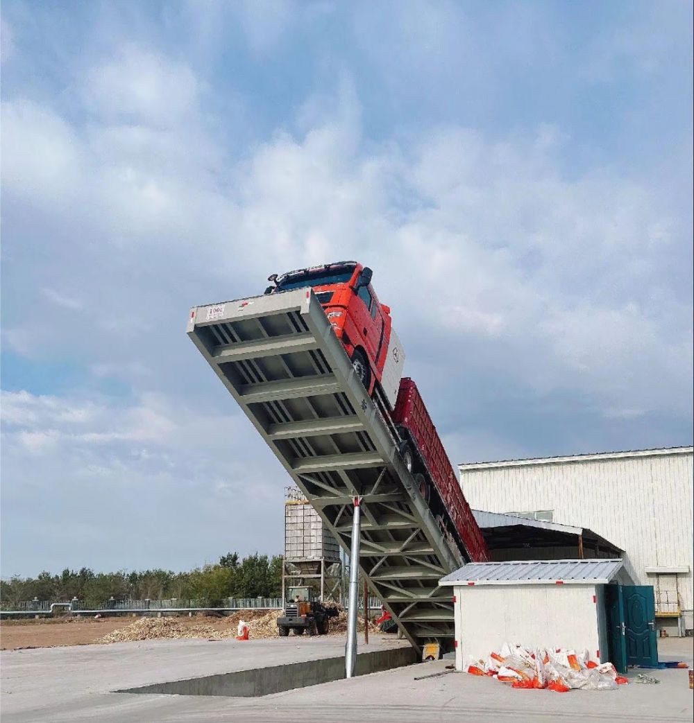 液壓卸車機(jī)、后翻式液壓翻板卸車平臺(tái)、河南愛信液壓翻板機(jī)